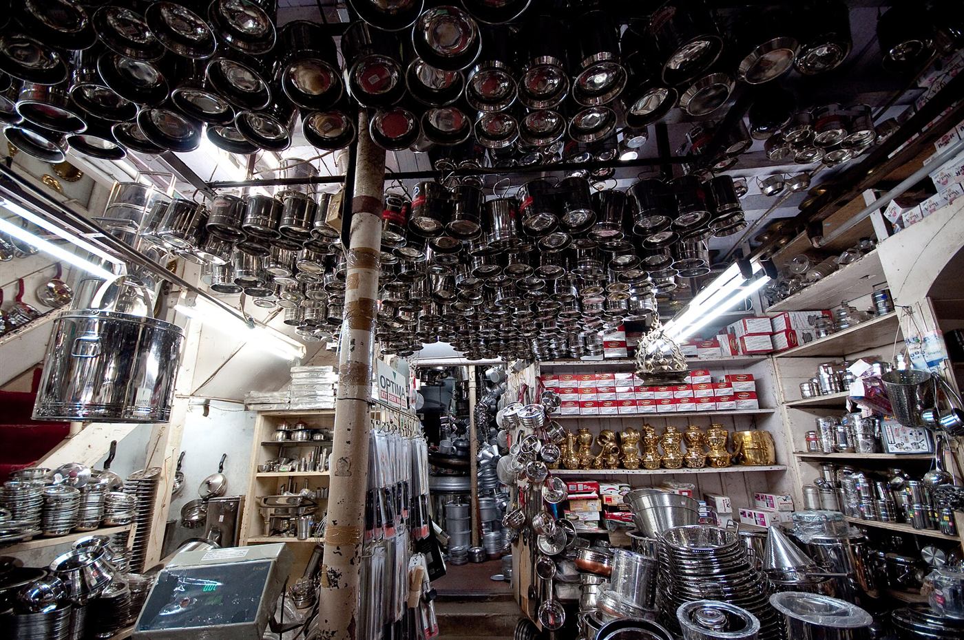 Shop stacked floor to ceiling with stainless steel vessels, bowls and containers